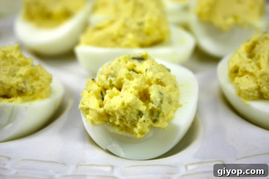 Amazing Deviled Eggs - 3 Ingredient deviled eggs. This is our favorite deviled egg recipe, it's always requested for potlucks and parties!