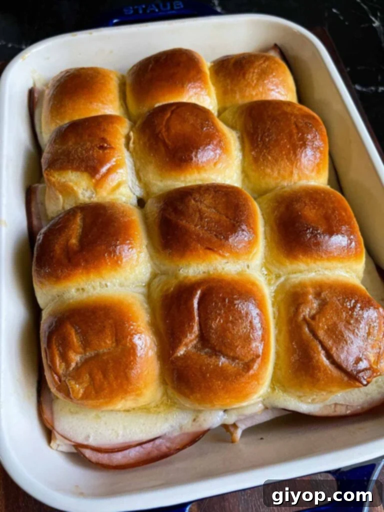Cooked Monte Cristo sliders in a baking dish.