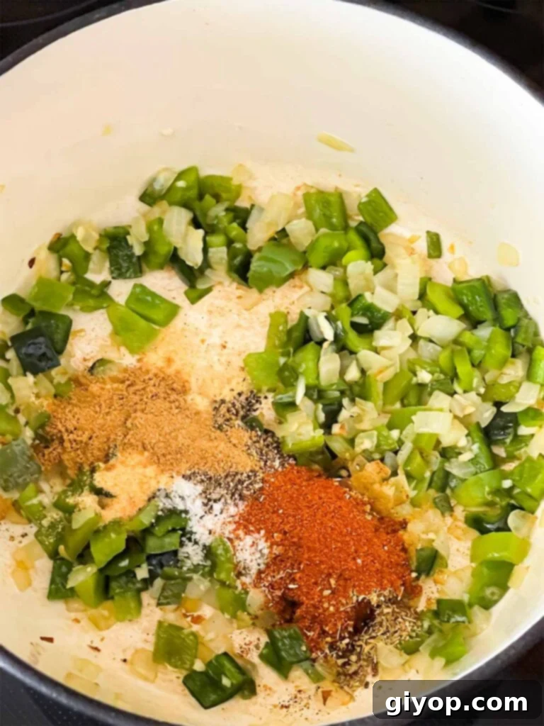 Spices added to cooked vegetables in a dutch oven.