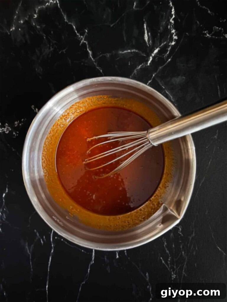 Smoky Gochujang Fire Chicken Legs 6 A gochujang marinade in a silver mixing bowl.