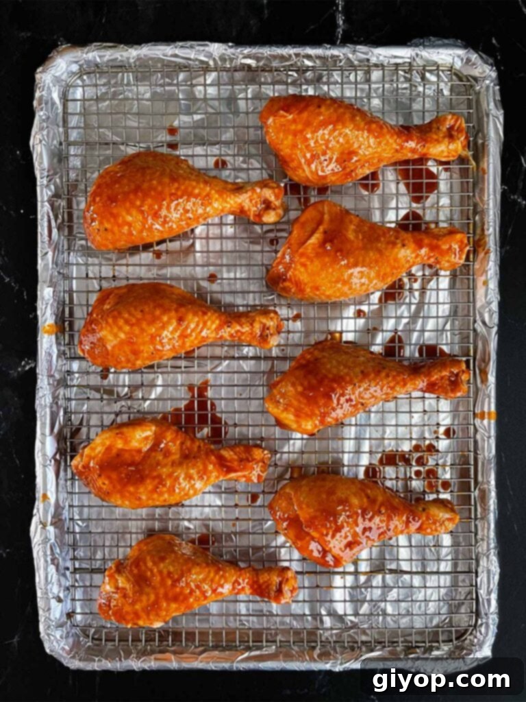 Smoky Gochujang Fire Chicken Legs 7 Marinated chicken legs on a cooling rack ready to go onto the smoker.