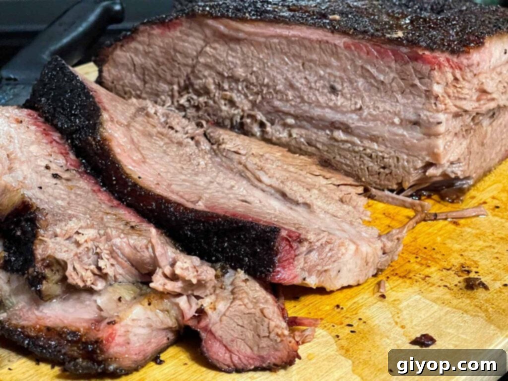Slices of brisket from the point side on a cutting board.
