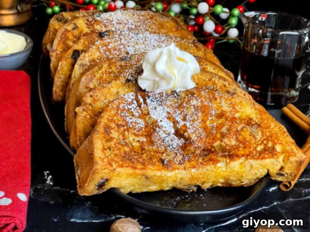 Slices of panettone French toast garnished with powdered sugar, whipped cream, and maple syrup on a dark plate, ready to be enjoyed.