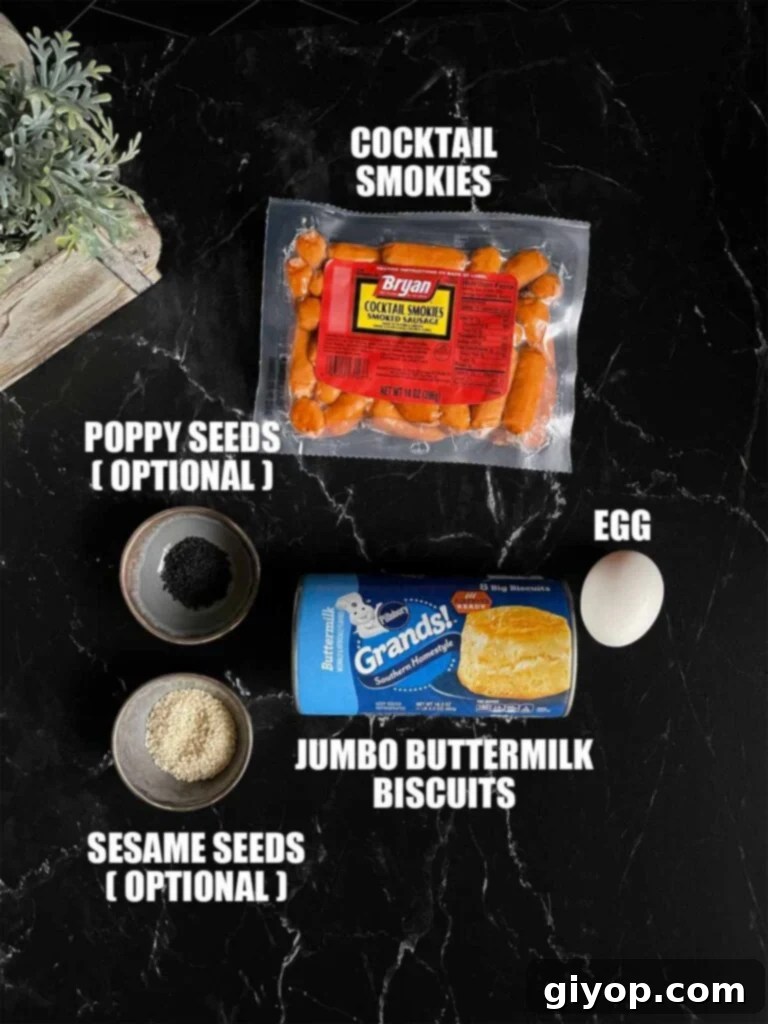 Pigs in Fluffy Biscuits 3 Ingredients for pigs in a blanket on a dark surface.