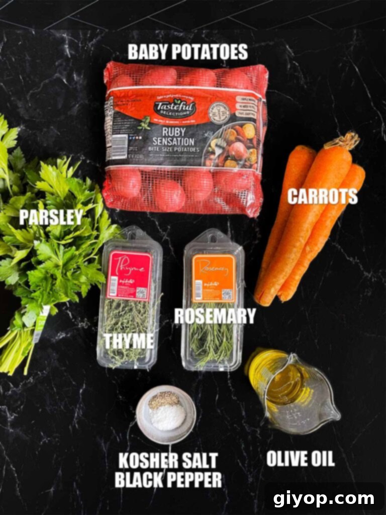 A collection of fresh ingredients for roasted potatoes and carrots laid out on a dark surface, including potatoes, carrots, olive oil, and various herbs.