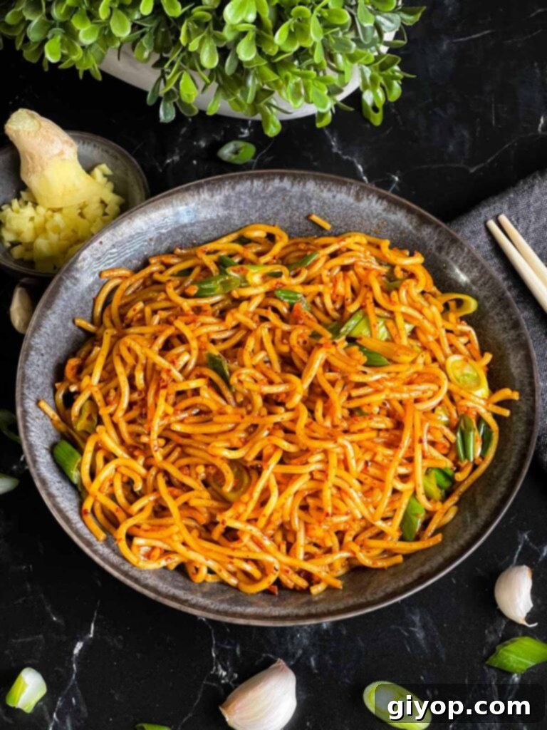A bowl of spicy garlic noodles ready to be eaten.