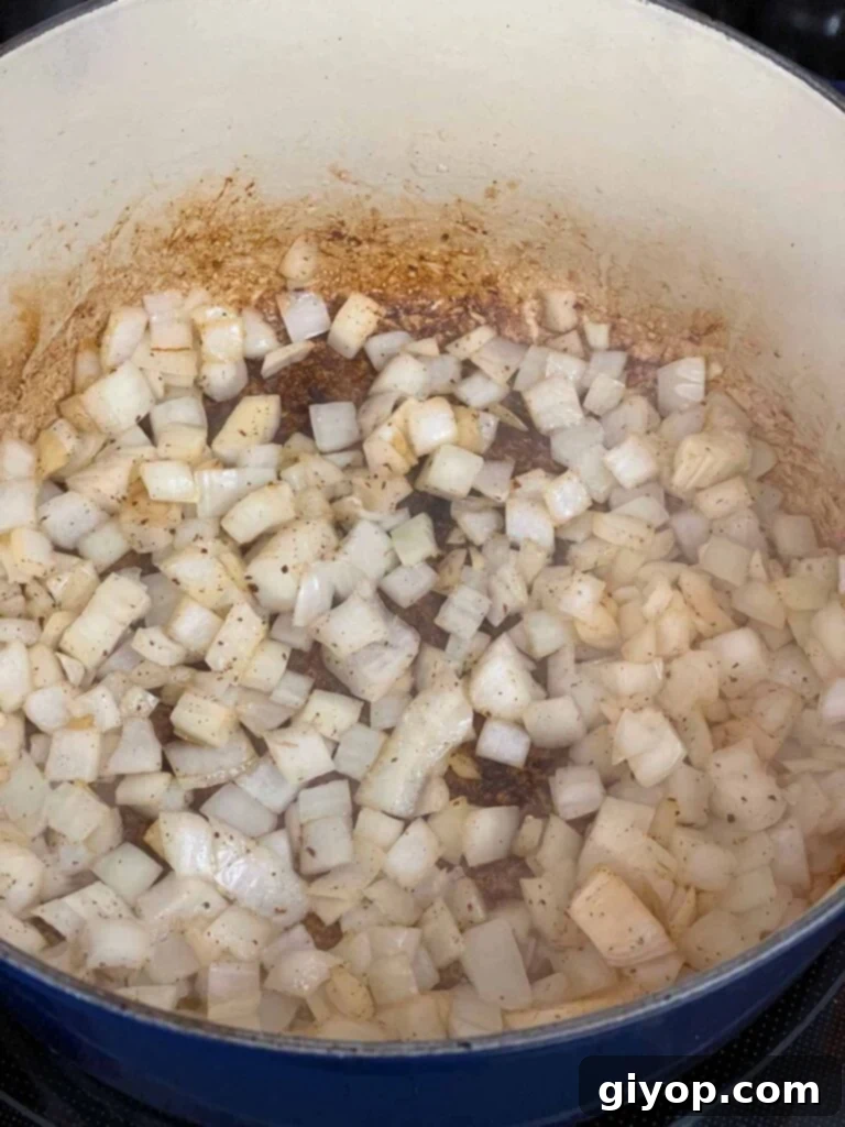 Onions cooking in a dutch oven.