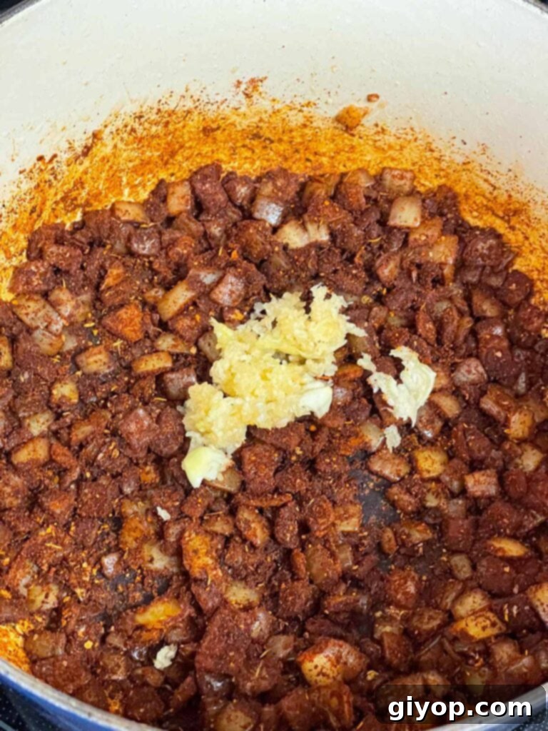 Garlic added to onions and spices for a brisket chili.