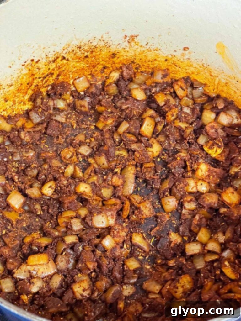 A brisket chili base (spices and onions) in a dutch oven.