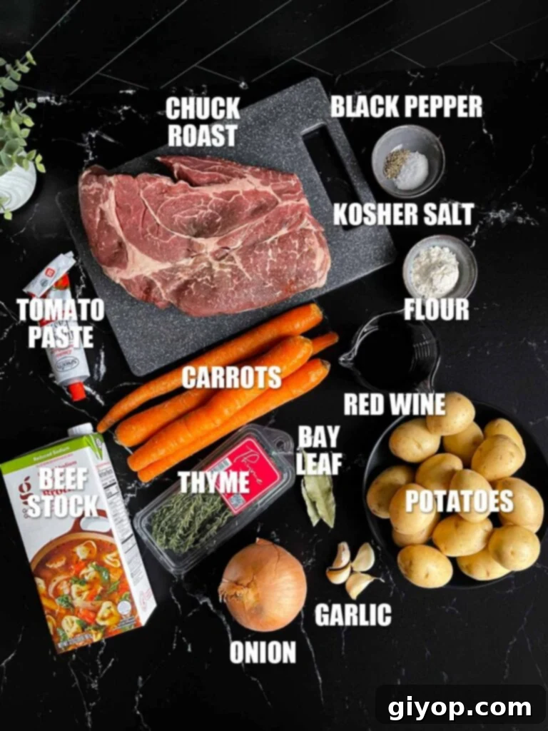 Classic pot roast recipe ingredients on a dark surface.