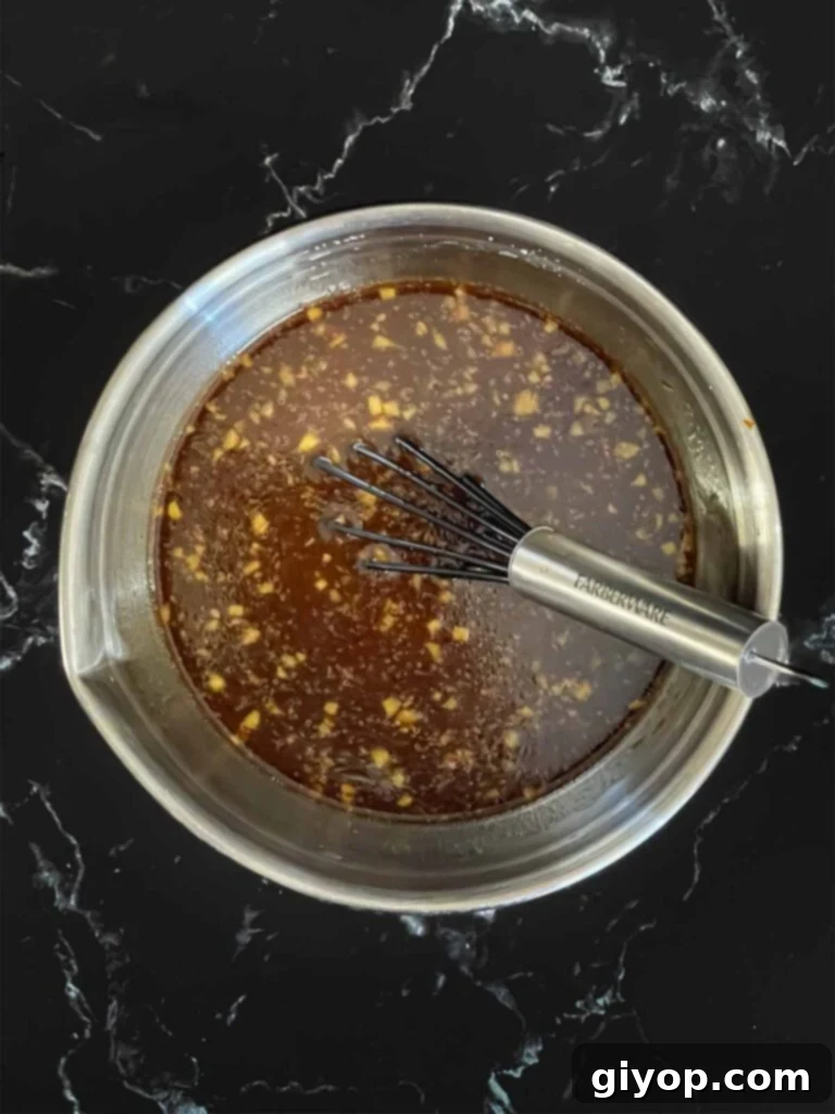 Bourbon sauce for bourbon chicken in a sauce pan.