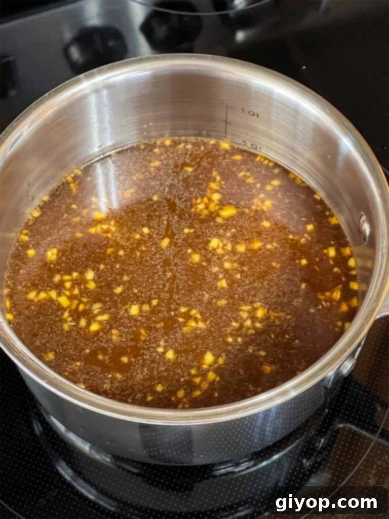 Bourbon sauce for bourbon chicken in a sauce pan.