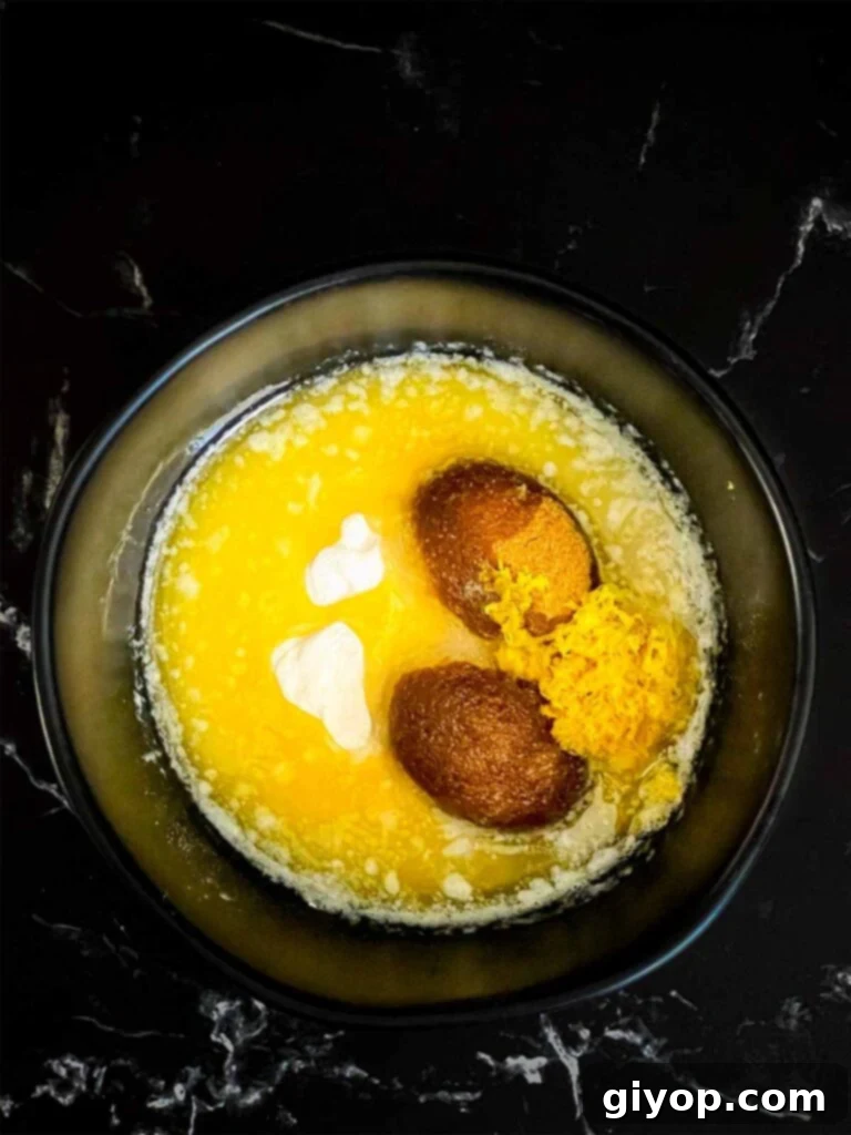 Lemon crumb cake crumble ingredients in a dark bowl.