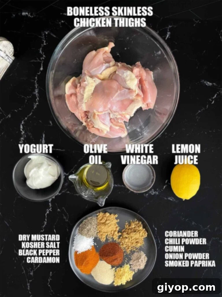 Ingredients needed to make chicken shawarma on a dark plate.