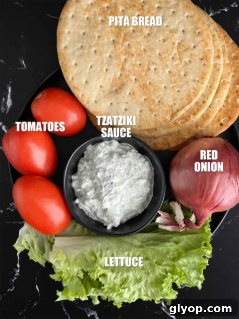 A plate of produce for chicken shawarma on a dark plate.