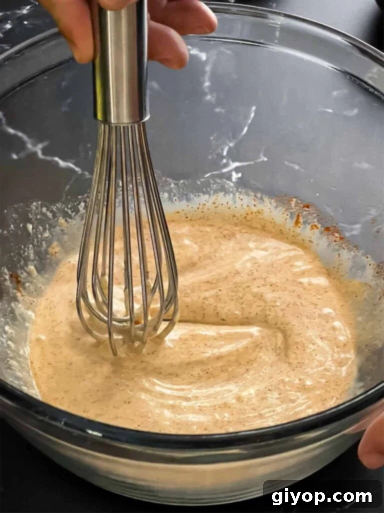 Ancho slaw dressing in a bowl, showing its creamy texture.