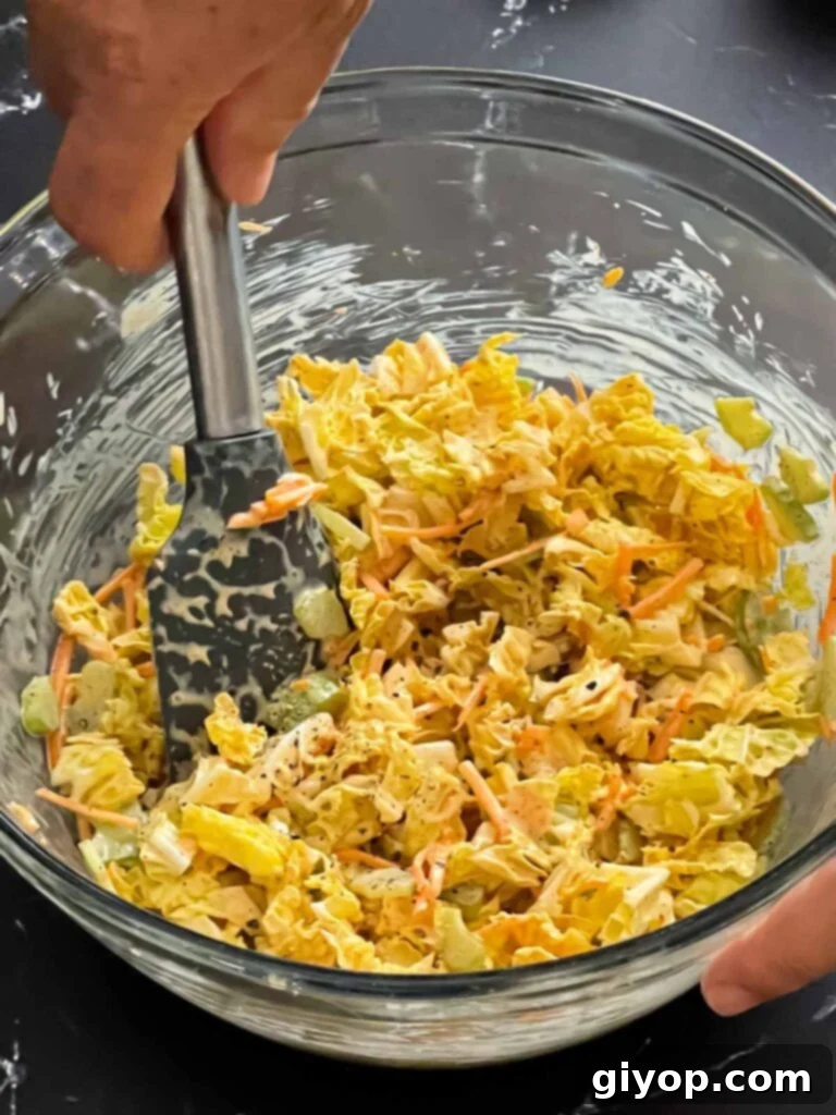 Ancho slaw fully mixed in a bowl, ready to chill.