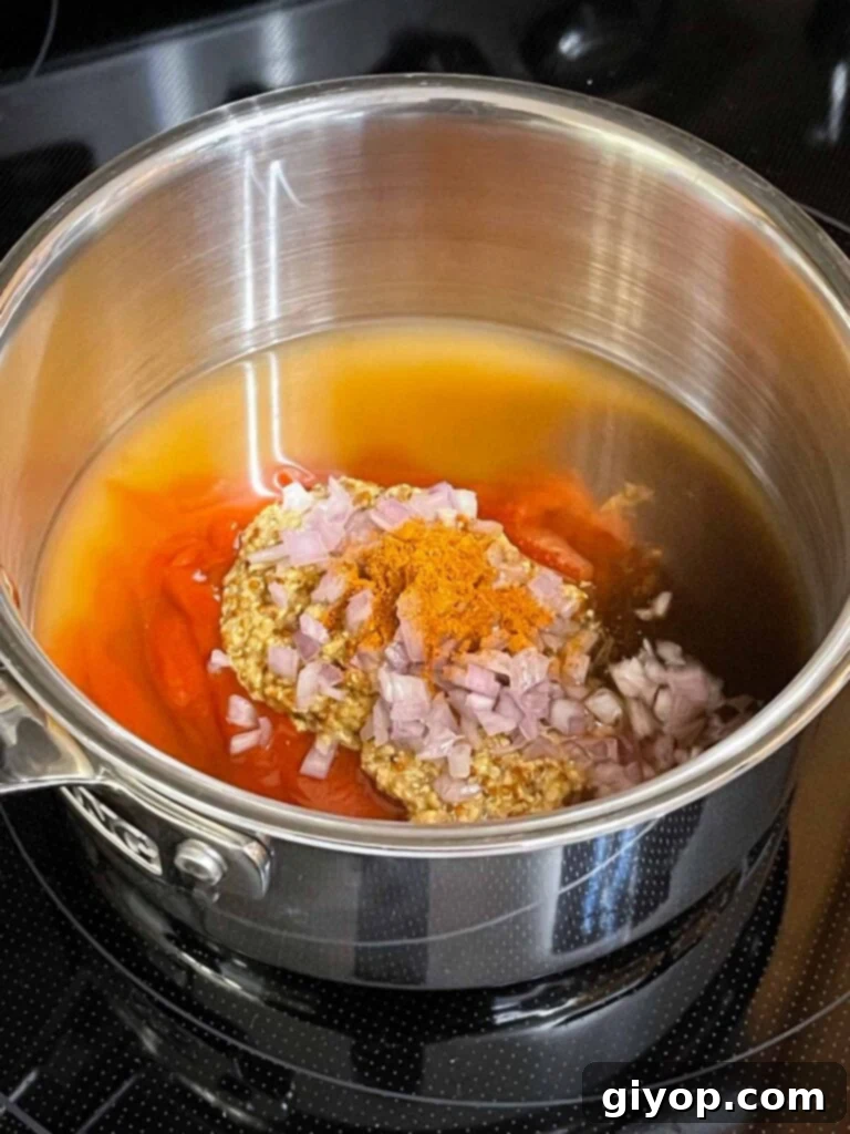 All ingredients combined in a saucepan to make Carolina barbecue sauce.