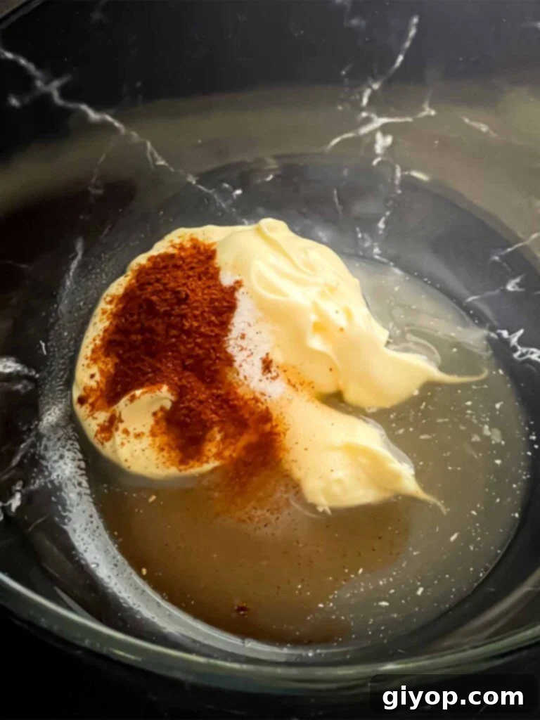 Wet ingredients for ancho slaw dressing being whisked.