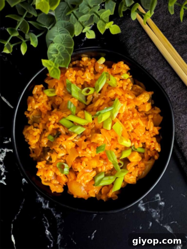 Kimchi fried rice in a dark bowl.
