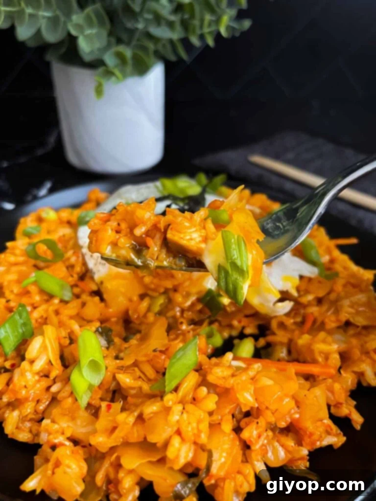 A forkful of kimchi fried rice.