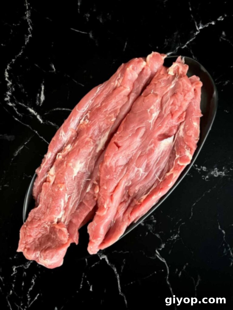 Grilled Mojo Pork Roulade 5 Pork tenderloin carefully roll-cut and ready for flattening.