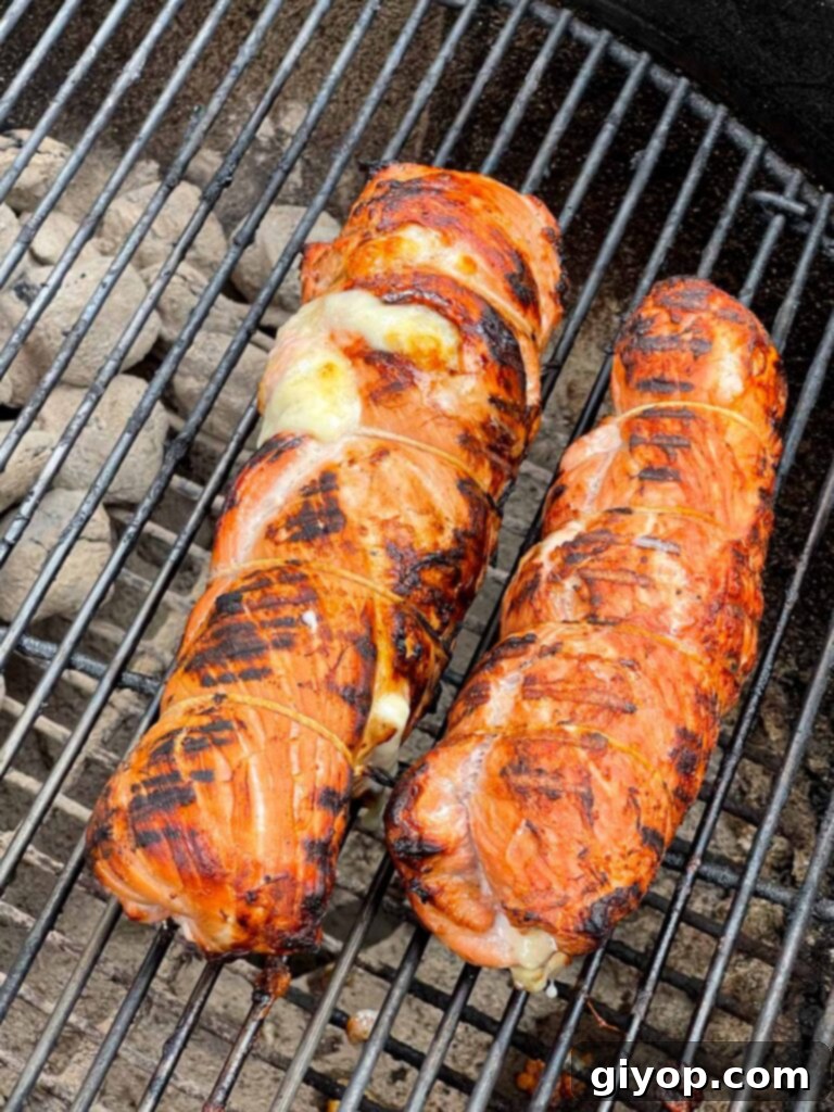 Grilled Mojo Pork Roulade 10 Stuffed Cuban pork tenderloin grilling over direct heat for a perfect sear.