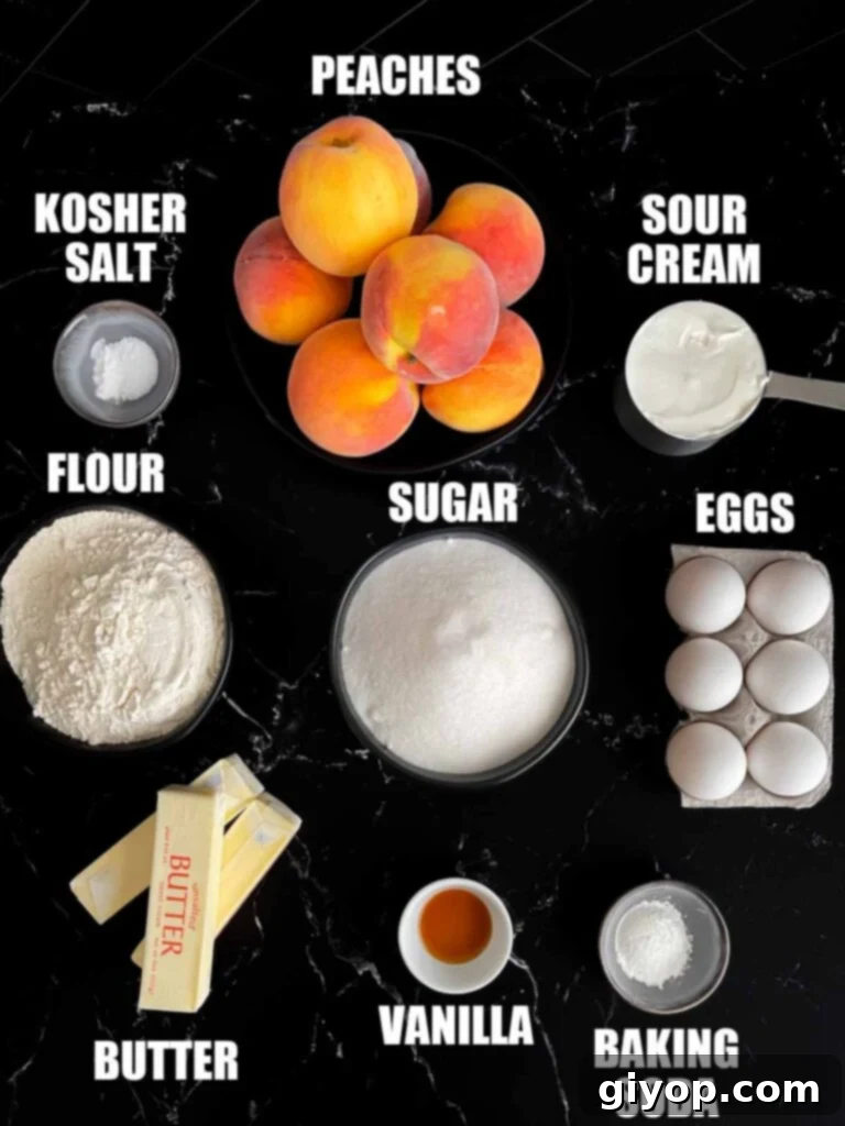 All the essential ingredients for making peach pound cake are neatly arranged on a dark, rustic surface, highlighting fresh peaches, butter, eggs, flour, and sugar.