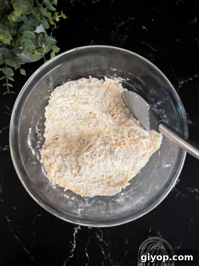 Smoky Bacon Cheddar Delights 4 Shredded cheddar cheese and cooked bacon stirred into the dry ingredients for bacon cheddar biscuits recipe.