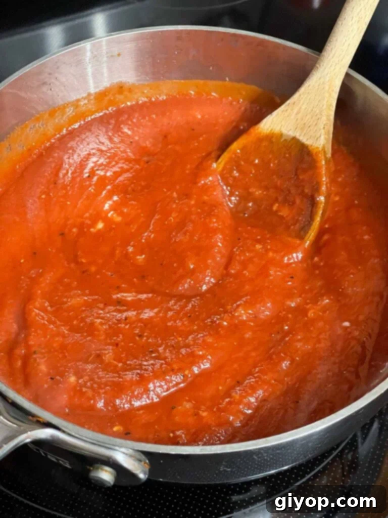 Homemade marinara sauce in a saucepan.