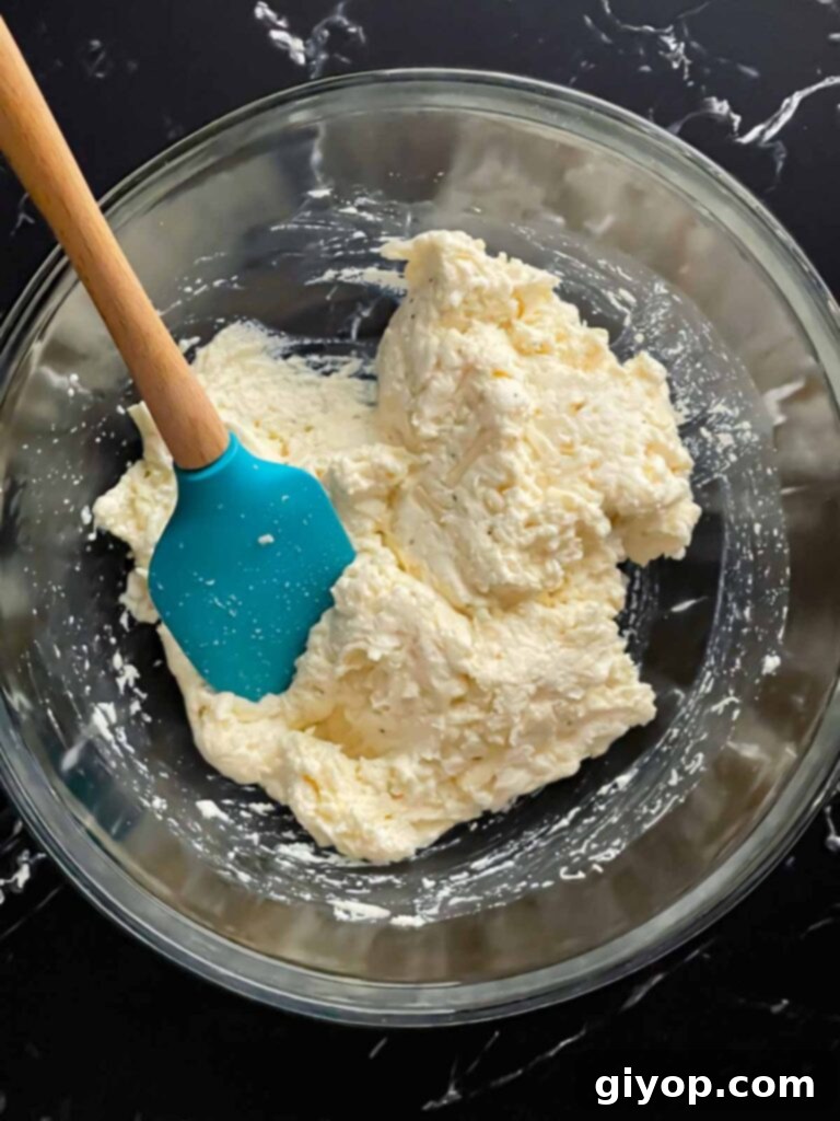 Ricotta mozzarella cheese mixture in a glass bowl.