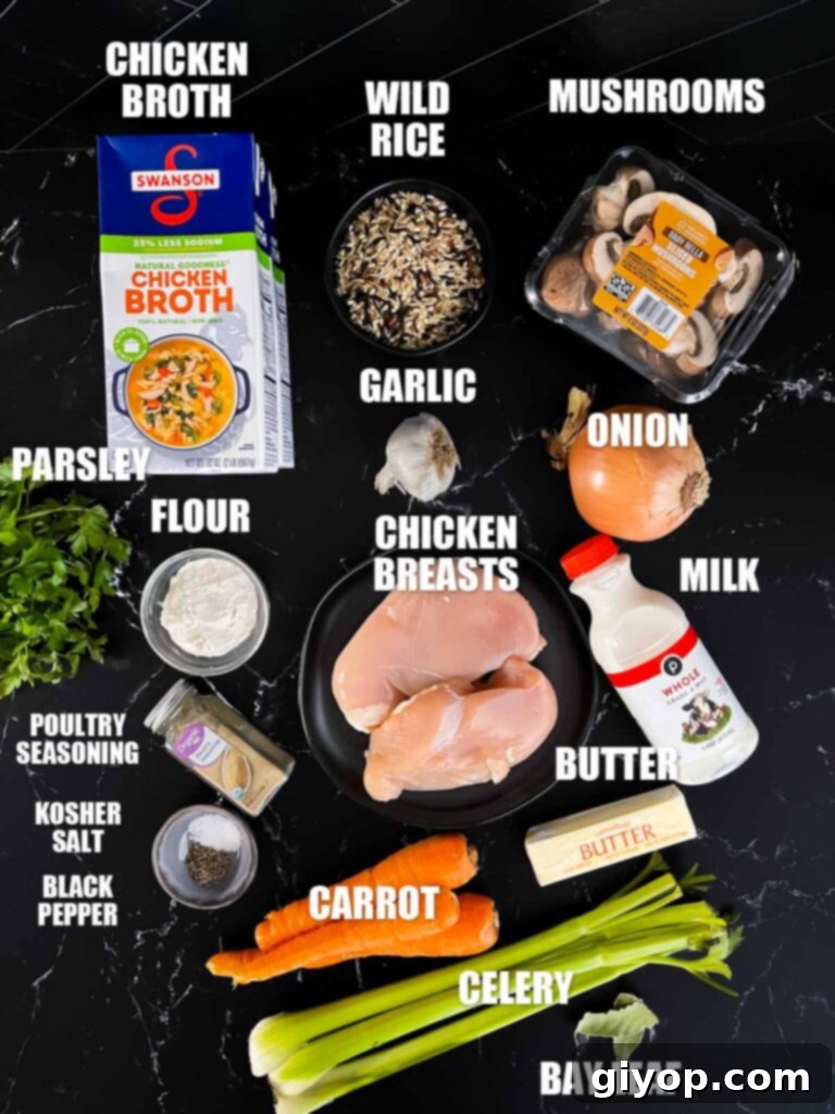 Soul-Warming Slow Cooker Chicken and Wild Rice Soup 3 A curated selection of fresh ingredients for slow cooker chicken and wild rice soup laid out on a dark surface.