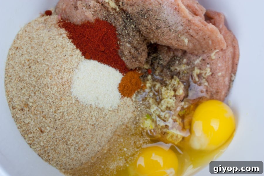 Firecracker chicken meatball ingredients in a large mixing bowl.