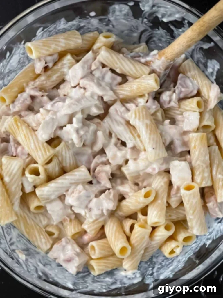 Chicken Alfredo Casserole mixture in a glass bowl.
