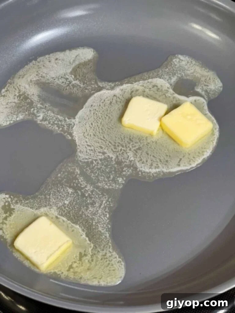 Melting butter in a skillet.