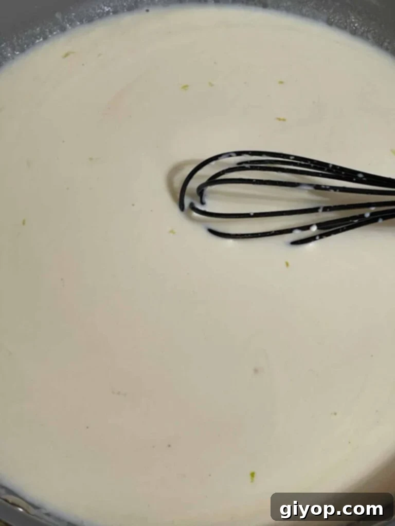 An alfredo sauce in a skillet.