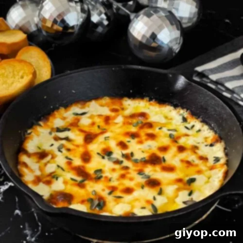 Baked Ricotta dip in a cast iron skillet.