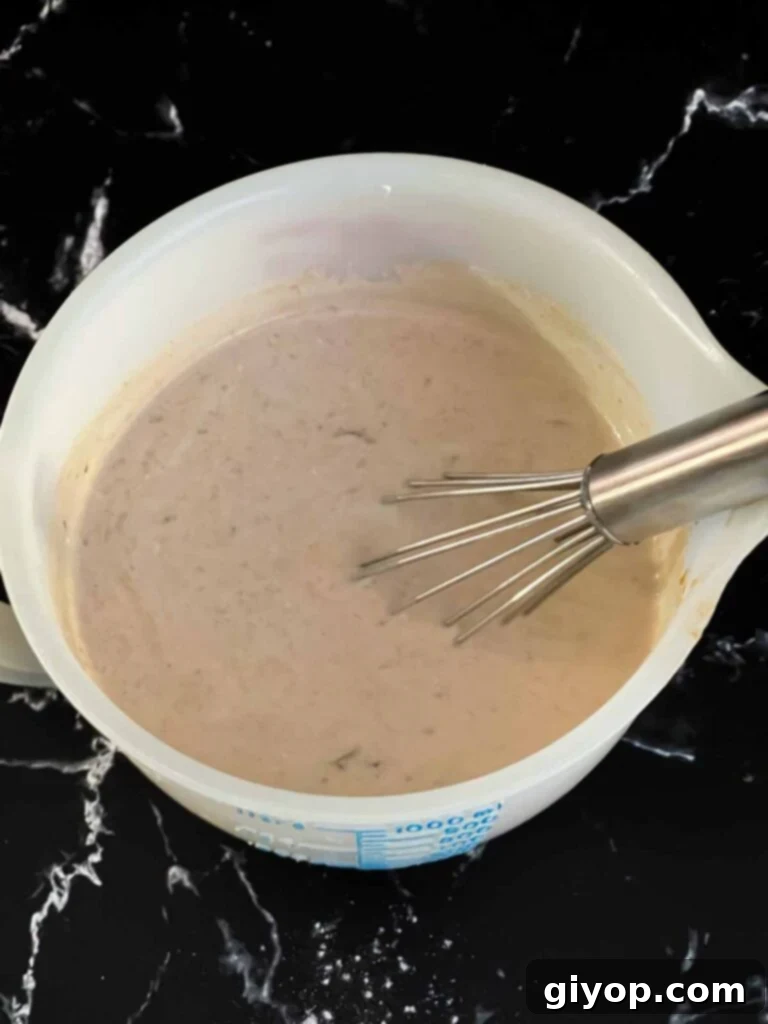 Slow Cooker Beef Stroganoff From Scratch 8 Sour cream mixed with a beef stroganoff gravy.