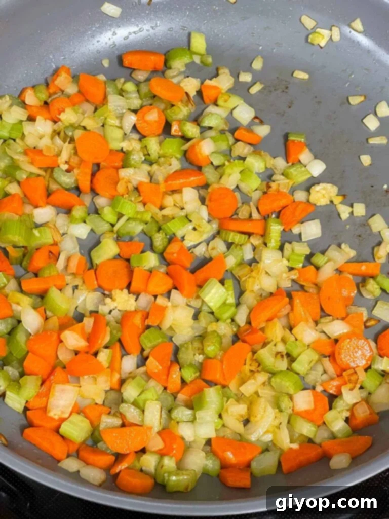 Softened and cooked mirepoix in a skillet, ready for the next step.