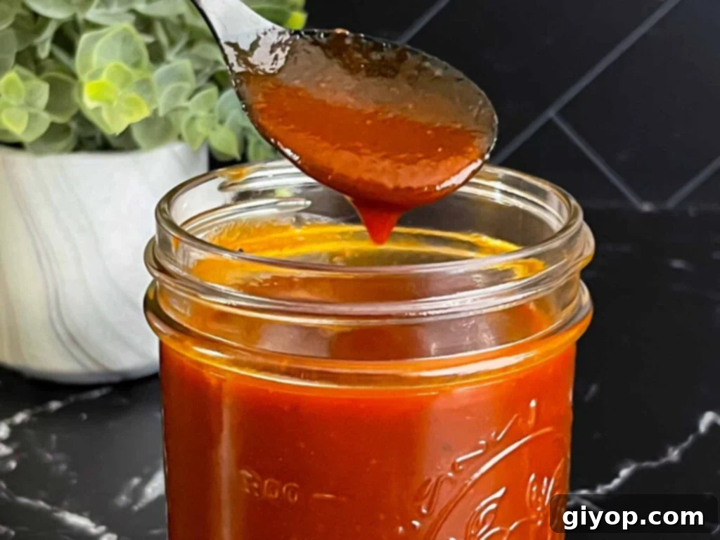 Legendary Kansas City Barbecue Sauce 2 A bottle of homemade Kansas City style barbecue sauce, ready for use.