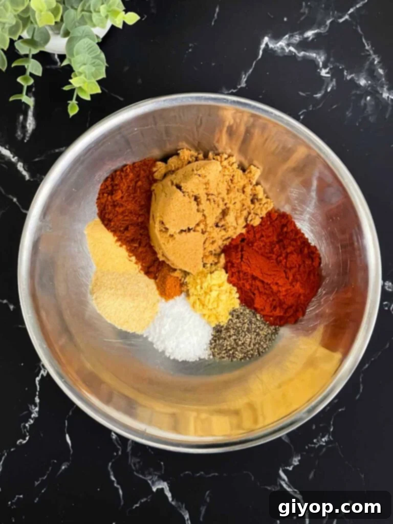 Kansas City Style BBQ Rub 4 Kansas City Style Barbecue Rub ingredients in a bowl.