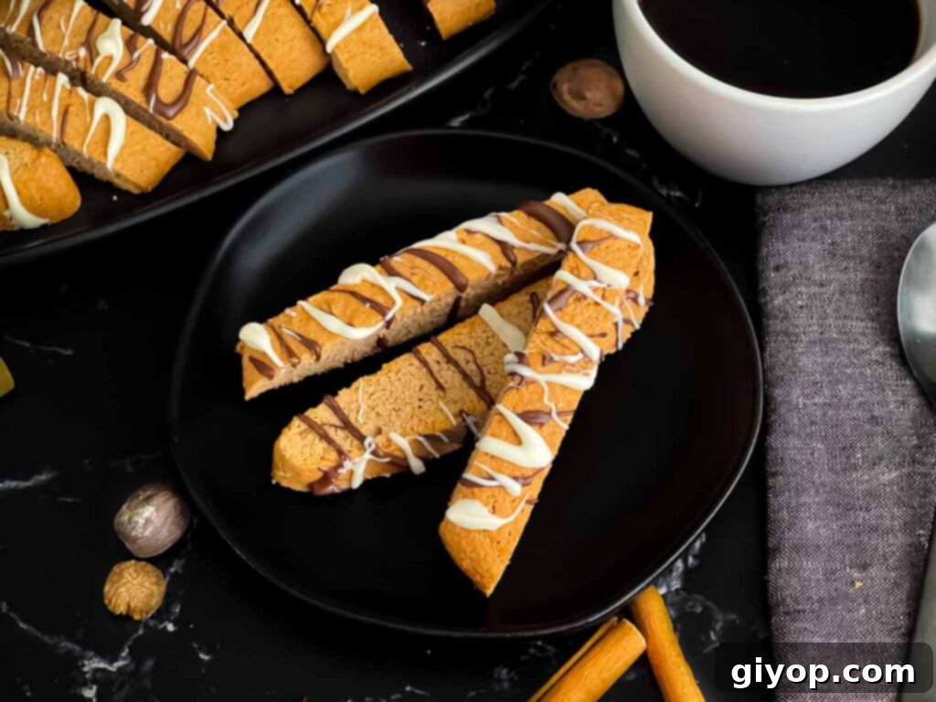 Chai biscotti on a dark plate, perfectly crisp and ready for dunking.