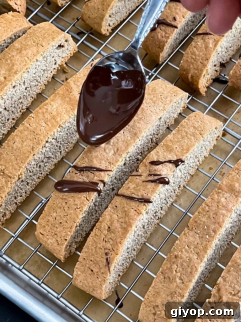 Adding a elegant chocolate drizzle to the chai biscotti.