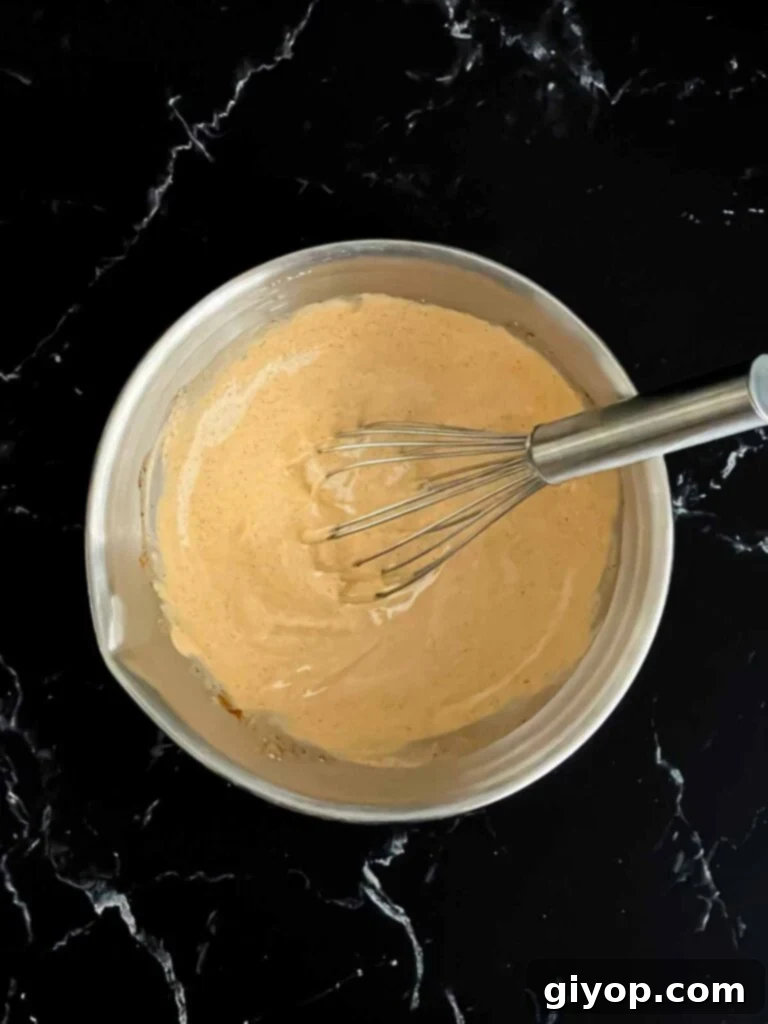 The creamy southwest sauce ingredients after being thoroughly whisked together in a bowl.