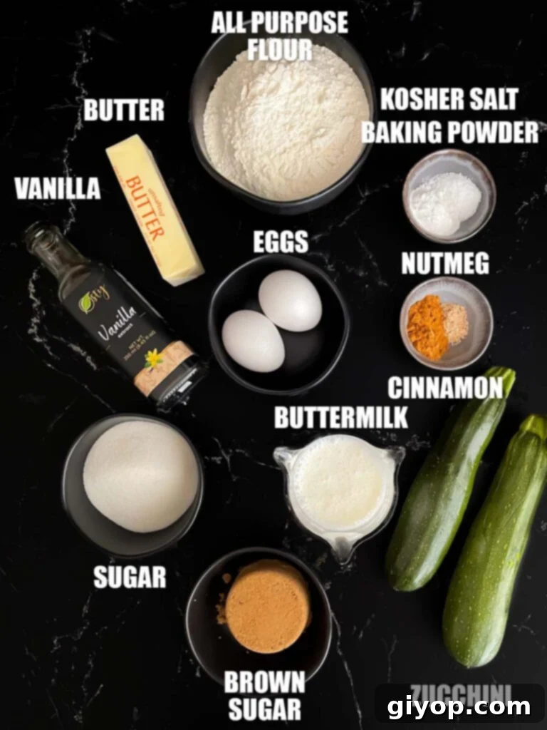 A collection of fresh ingredients for zucchini muffins, neatly arranged in bowls and measuring cups, ready for mixing.