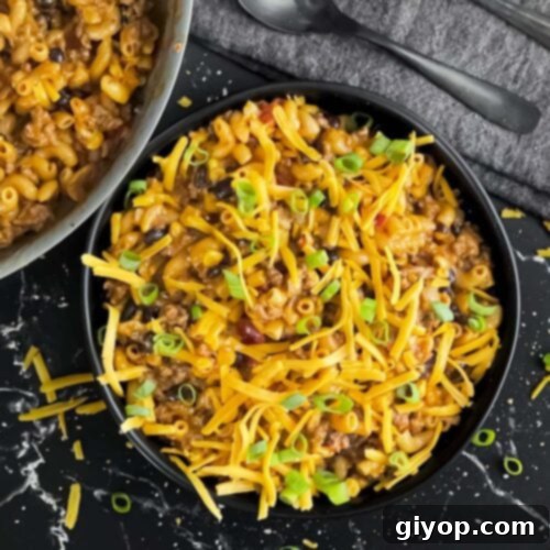 Taco pasta skillet dinner in a dark bowl.