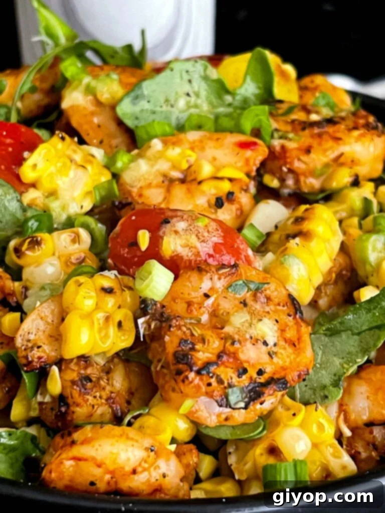 A top-down view of the grilled shrimp and corn salad, highlighting the texture and color.