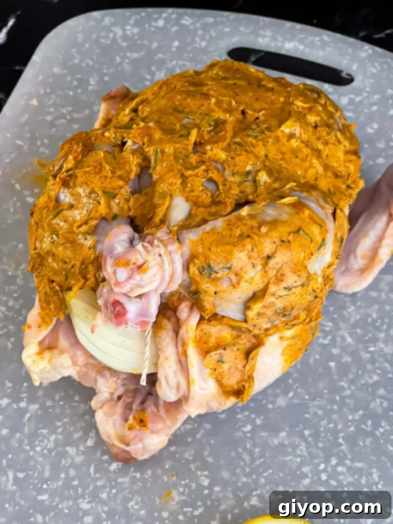 Lemon herb butter mixture spread over the whole chicken before placing in the slow cooker.