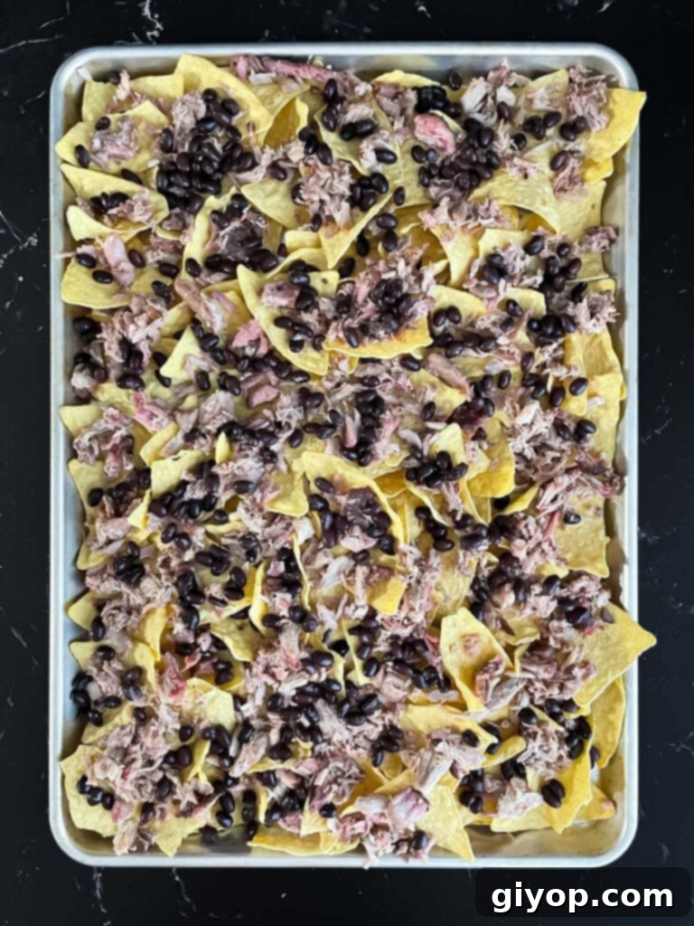 Smoky Pulled Pork Nachos 7 Tortilla chips topped with smoked pork and black beans.