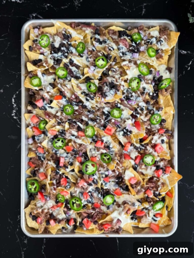 Smoky Pulled Pork Nachos 8 A tray of pulled pork nachos.